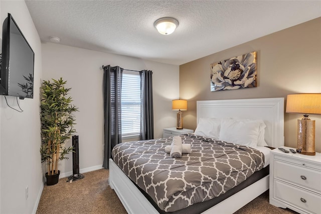 carpeted bedroom with a textured ceiling