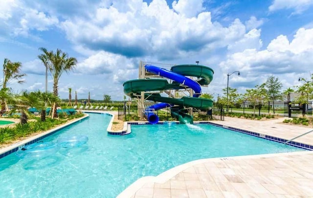 view of pool featuring a water slide