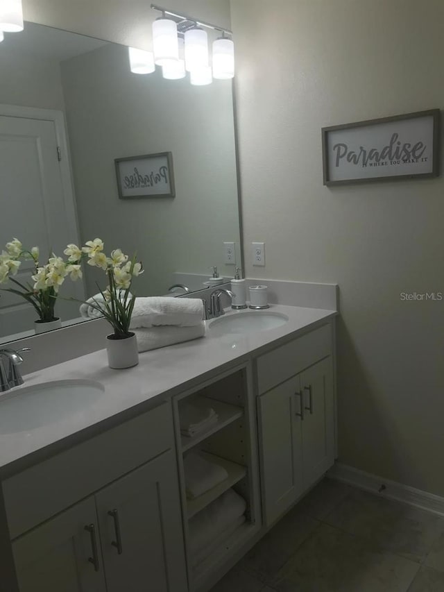 bathroom with dual bowl vanity and tile flooring