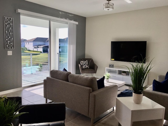 living room with tile flooring and plenty of natural light