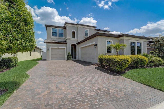 view of front of house featuring a garage and a front yard