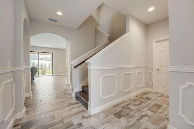 staircase with light hardwood / wood-style flooring