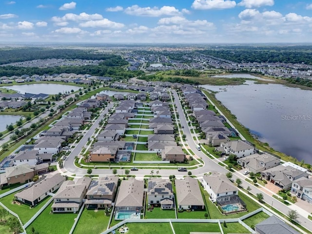 birds eye view of property featuring a water view