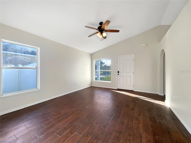 unfurnished room with lofted ceiling, ceiling fan, and dark hardwood / wood-style flooring