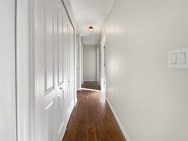 hall with dark hardwood / wood-style floors