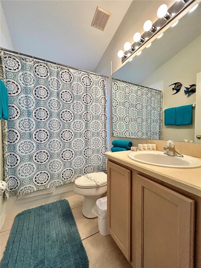 full bathroom with tile patterned flooring, vaulted ceiling, toilet, vanity, and shower / tub combo