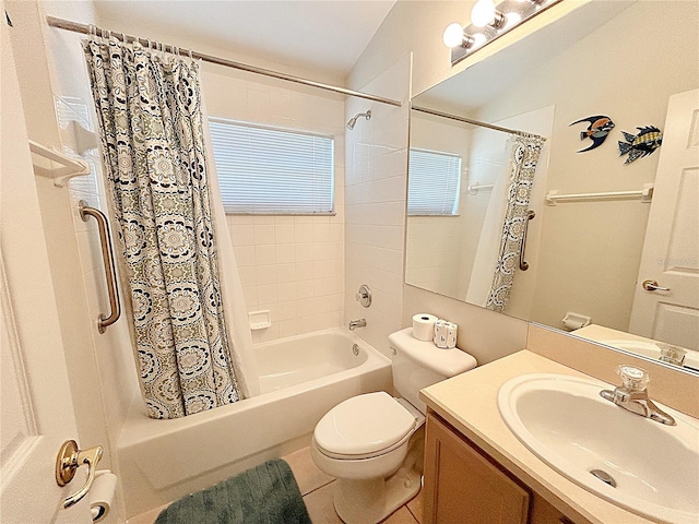 full bathroom with vanity, vaulted ceiling, tile patterned flooring, toilet, and shower / tub combo