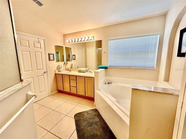 bathroom with tile patterned flooring, vanity, separate shower and tub, and lofted ceiling