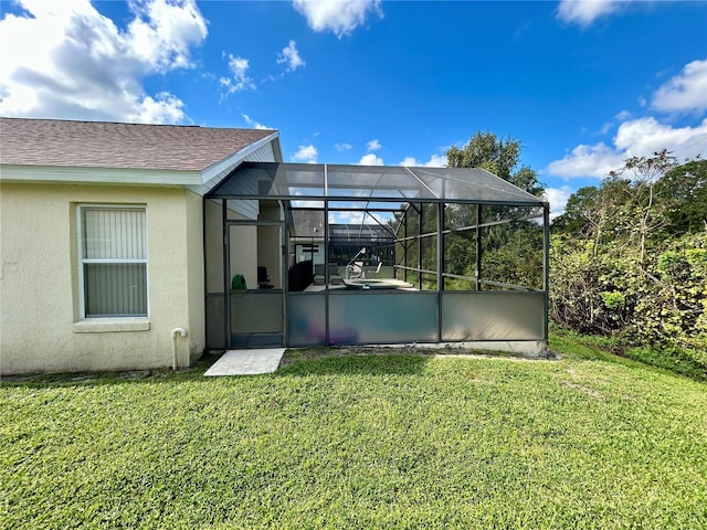 view of yard with glass enclosure