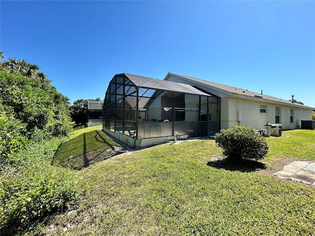 rear view of house featuring central AC unit, a lanai, a yard, and a pool