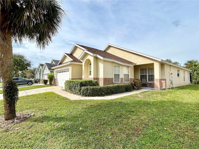 view of front of house with a front yard and a garage