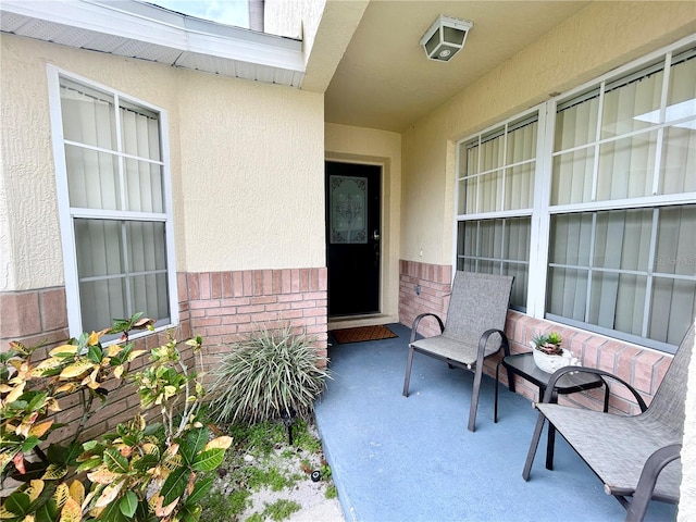 property entrance featuring a patio