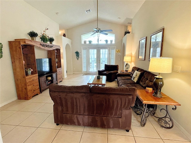 living room featuring ceiling fan, french doors, light tile patterned flooring, and high vaulted ceiling