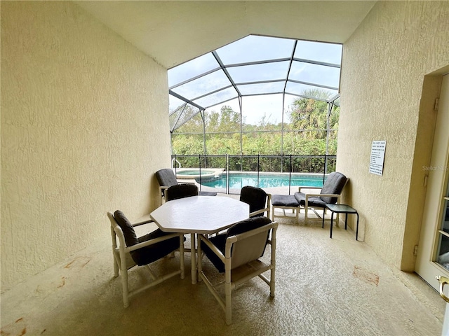 view of patio with glass enclosure