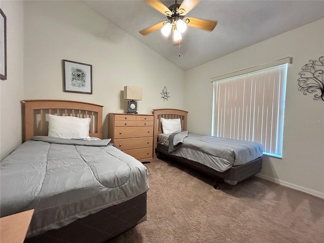 carpeted bedroom featuring a ceiling fan, lofted ceiling, and baseboards