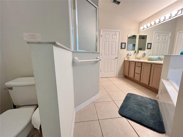 bathroom featuring a walk in shower, toilet, double vanity, tile patterned flooring, and lofted ceiling