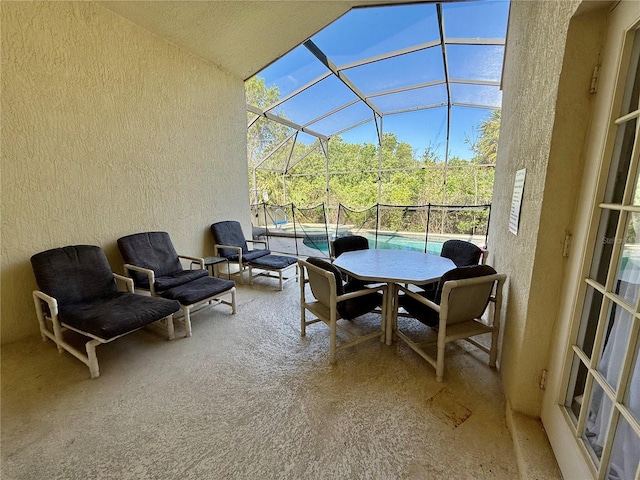 balcony featuring a patio area and a sunroom