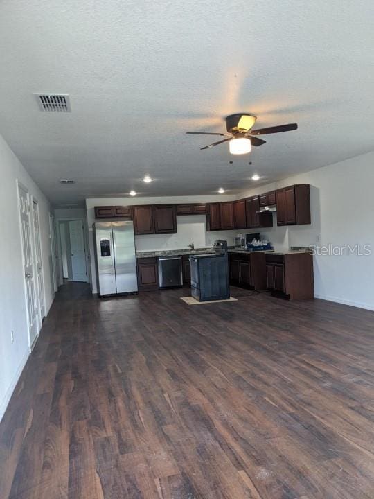 kitchen featuring stainless steel refrigerator with ice dispenser, dark wood-type flooring, dark brown cabinets, dishwashing machine, and a kitchen island