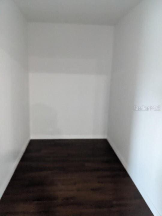 776 E Broadway St, Oviedo, FL 32765 - empty room with dark hardwood / wood-style flooring