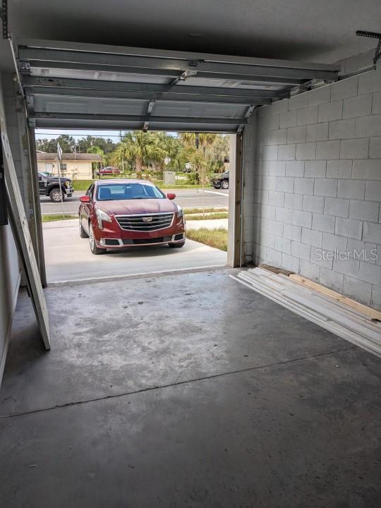 garage featuring a carport