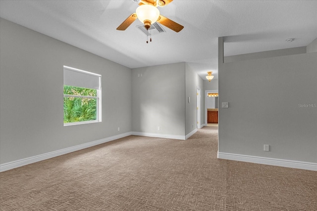 empty room with ceiling fan and carpet