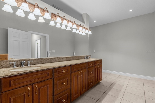 bathroom with dual bowl vanity and tile flooring