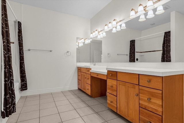 bathroom with tile flooring and large vanity