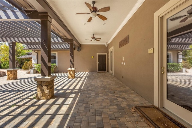 view of patio with ceiling fan and a pergola