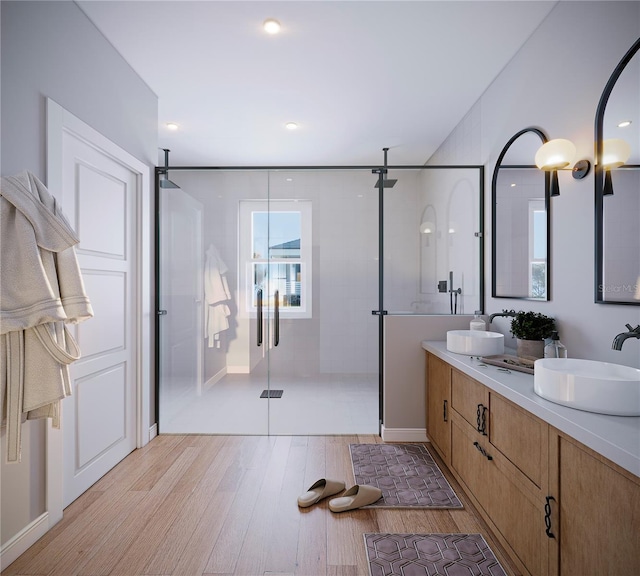 bathroom with vanity, hardwood / wood-style floors, and walk in shower