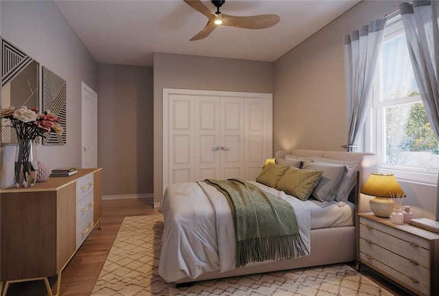 bedroom featuring light hardwood / wood-style flooring, multiple windows, and ceiling fan