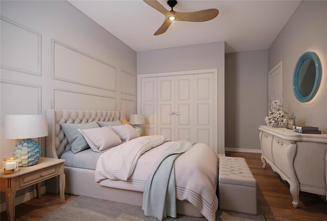 bedroom featuring a closet, dark hardwood / wood-style floors, and ceiling fan