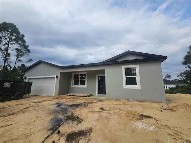 single story home with a garage