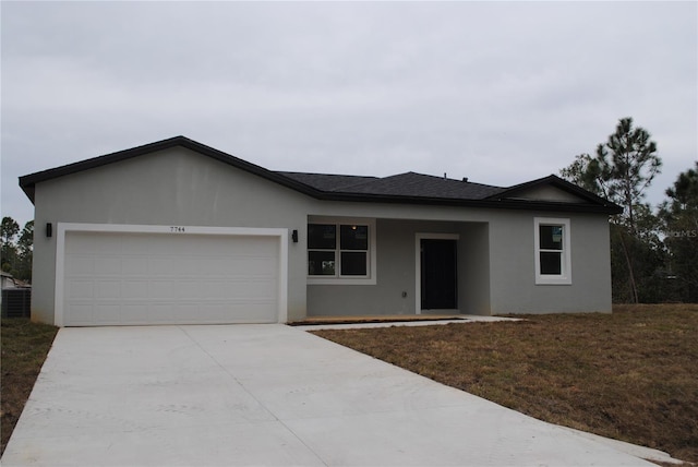 ranch-style house featuring a garage, concrete driveway, roof with shingles, a front lawn, and stucco siding