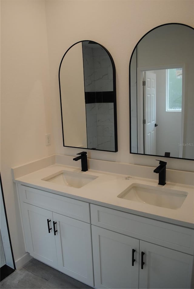 bathroom with double vanity and a sink