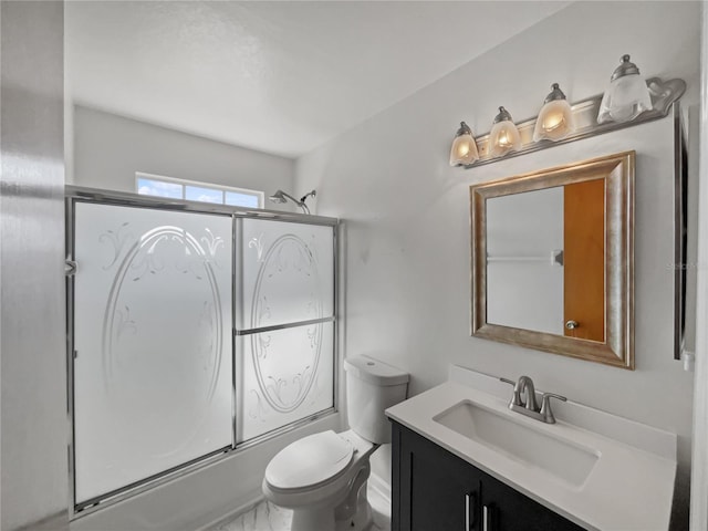 full bathroom with vanity, toilet, and combined bath / shower with glass door