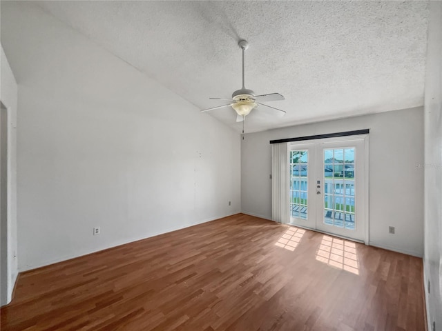 unfurnished room with lofted ceiling, french doors, ceiling fan, and light hardwood / wood-style floors