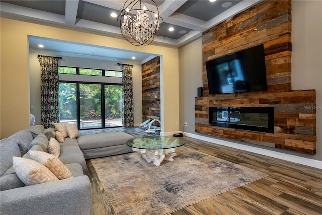 living room featuring coffered ceiling, dark wood-type flooring, beam ceiling, and a notable chandelier