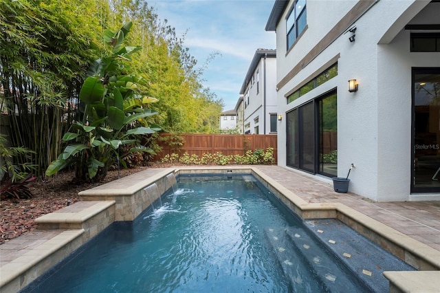 view of pool with pool water feature