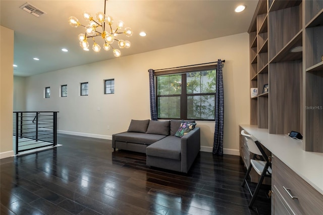 living room with dark hardwood / wood-style floors and a notable chandelier