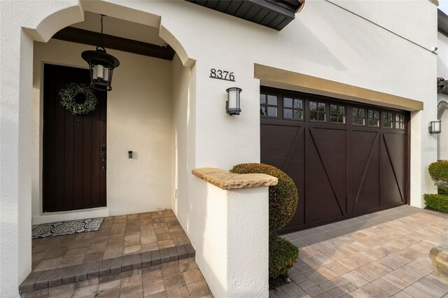 property entrance with a garage