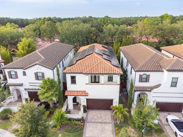 mediterranean / spanish house with a garage