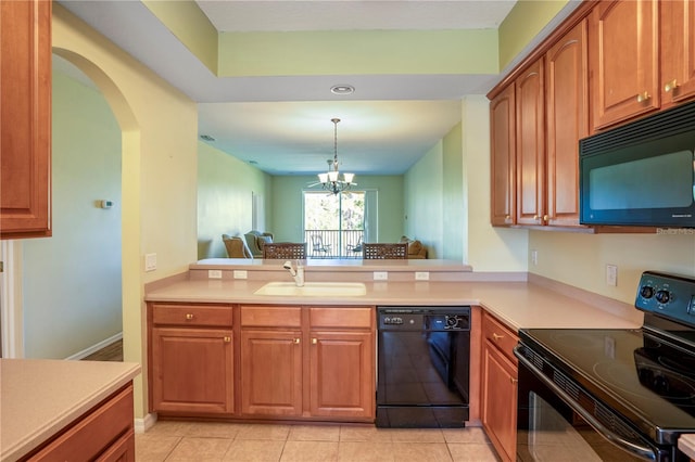 kitchen with sink, a chandelier, light tile floors, and black appliances