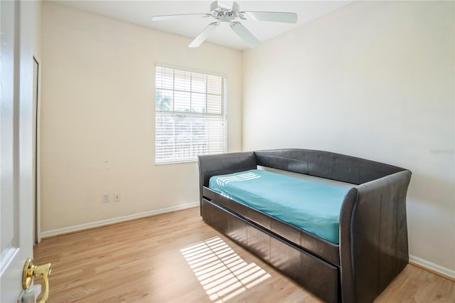 bedroom featuring light hardwood / wood-style floors and ceiling fan