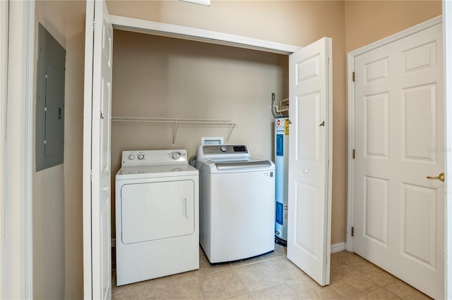 laundry area with water heater, washing machine and dryer, light tile floors, and hookup for a washing machine