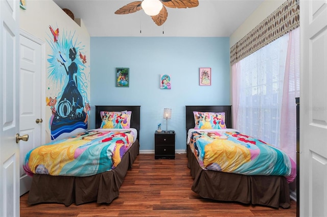 bedroom featuring ceiling fan and dark hardwood / wood-style flooring