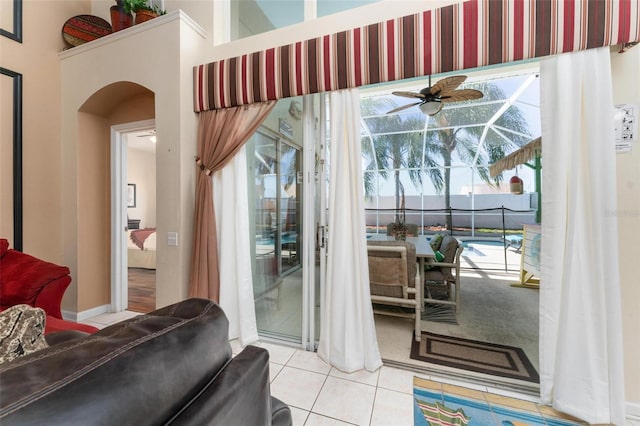 entryway featuring ceiling fan and light tile floors