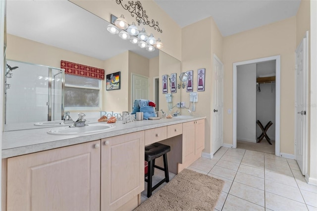 bathroom featuring tile flooring, oversized vanity, and dual sinks