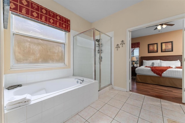 bathroom with tile flooring, ceiling fan, and shower with separate bathtub