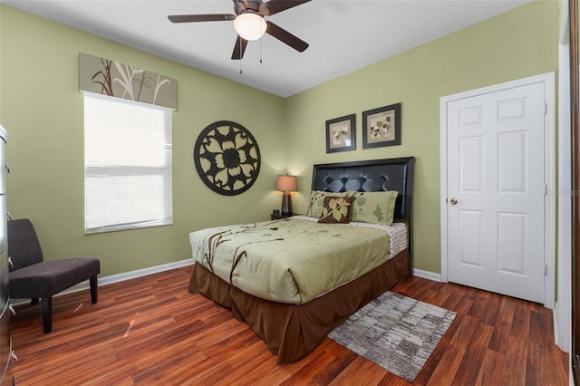 bedroom featuring dark hardwood / wood-style floors and ceiling fan