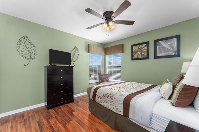 bedroom featuring dark hardwood / wood-style floors and ceiling fan